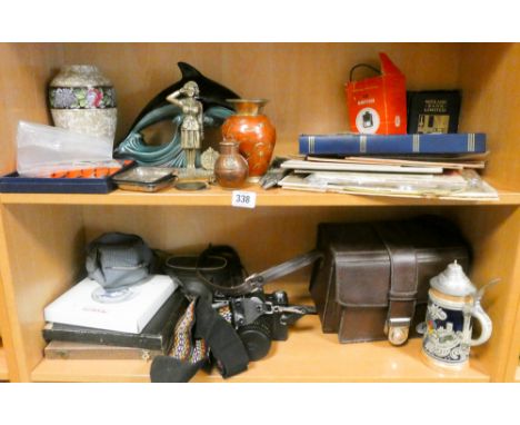 Poole pottery dolphin, Midland Bank money box, old bank notes, collectable cameras etc on two shelves 