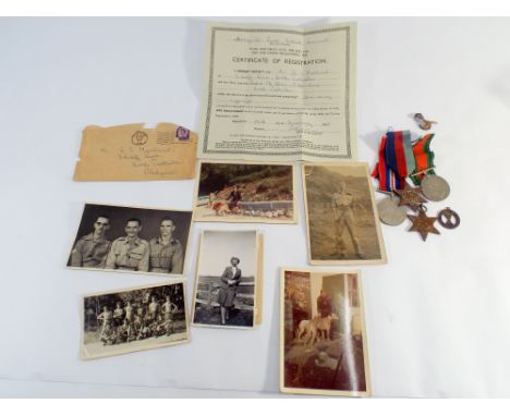 A Group of 4 medals consisting of 39/45 star, Burma star, defence and war medal together with a few badges, paperwork and pho