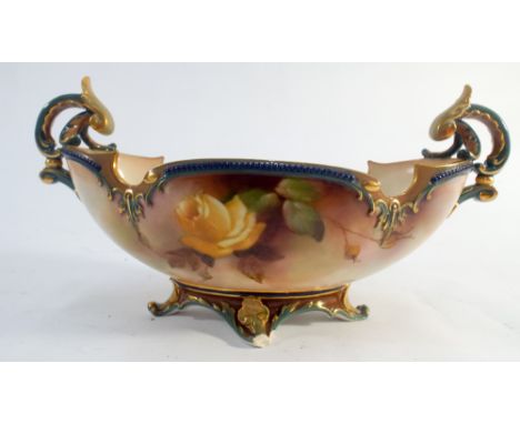 A twin handled Worcester bowl decorated with roses with a gilt border marked on bottom with impressed and a signed mark