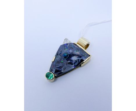 Modern unusual boulder opal, emerald and diamond pendant, set in a triangular setting in 18ct yellow gold. marked on reverse 