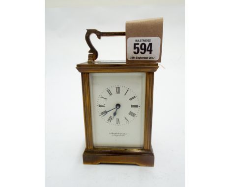 Brass carriage clock by Garrard London, overall height including handle 15cm, complete with key