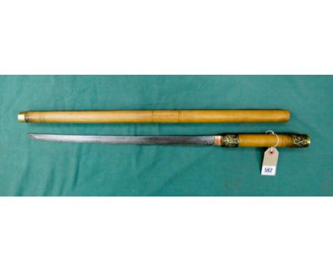 Japanese sword in the style of a stick or staff, brass filigree mounts and bamboo case. Overall length 82cm, blade length 45c