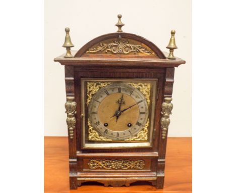 Edwardian striking black bracket clock with brass and silver dial in brass mounted oak case 