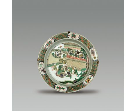 A LARGE FAMILLE VERTE BASIN KANGXI  (1662-1722) The basin is decorated in the center with a scene of women throwing fruits at