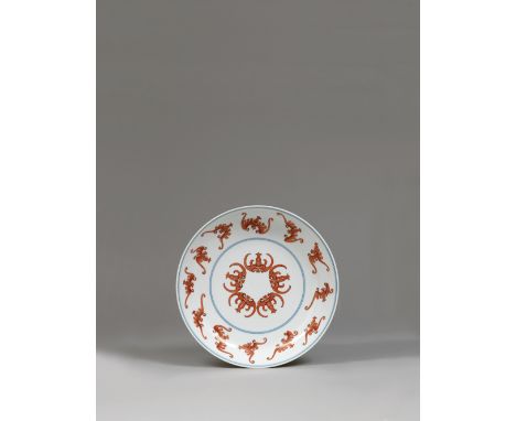 AN IRON-RED ENAMELLED ‘BATS’ DISH YONGZHENG SIX-CHARACTER MARK IN UNDERGLAZE BLUE WITHIN A DOUBLE CIRCLE AND OF THE PERIOD (1
