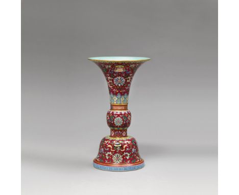 A RED-GROUND FAMILLE ROSE ‘BAJIXIANG’ VASE, GU QIANLONG SIX-CHARACTER SEAL MARK AND OF THE PERIOD (1736-1795)  Modelled after