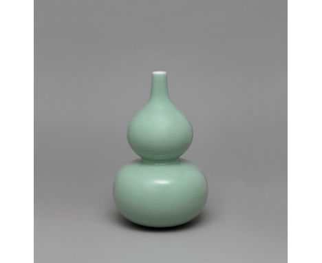 A CELADON-GLAZED DOUBLE-GOURD VASE QIANLONG SEAL MARK IN UNDERGLAZE BLUE AND OF THE PERIOD (1736-1795) Elegantly proportioned