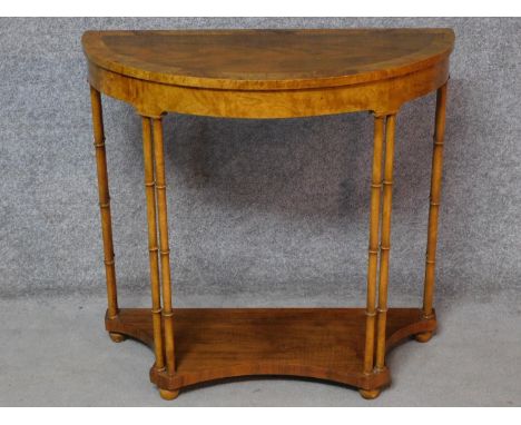 A Georgian style walnut and burr elm crossbanded demi lune console table, makers label to underside. H.78 L.82 W.39cm 