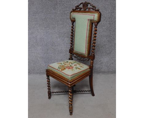 A Victorian carved rosewood side chair in tapestry upholstery on barleytwist stretchered supports. H.106cm 