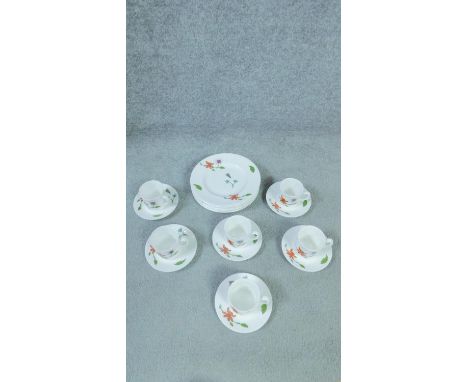 A Royal Worcester Astley hand painted porcelain coffee set. With floral and insect design. Largest 20.5cm. 