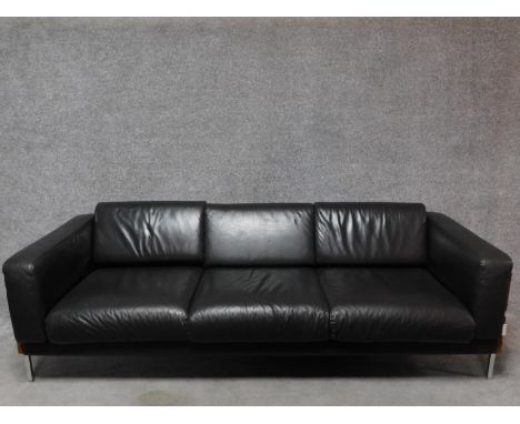 A three seater Robin Day Forum sofa in dark tan leather upholstery. H.65 W.210 D.80cm 