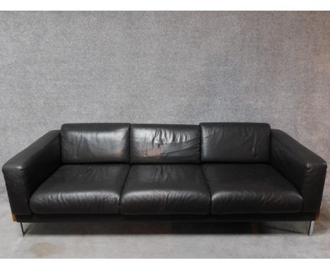 A three seater Robin Day Forum sofa in dark tan leather upholstery. H.65 W.210 D.85cm 