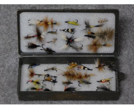 A collection of vintage fishing flies in portable case. 19x9cm (box size) 