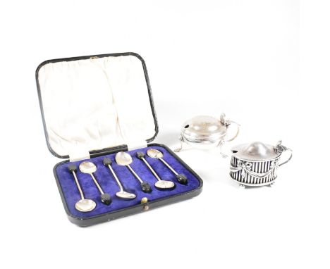 A collection of hallmarked silver items.The lot to include a cased set of six coffee spoons. The tea spoons each having a fin