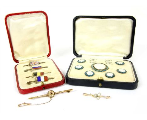 A cased set of four sterling silver enamelled flag tie pins or bar brooches, an Edwardian cased sterling silver brooch and bo