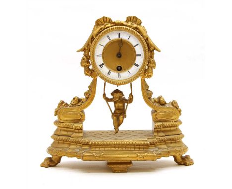 A French Portico type gilt clock, late 19th century to early 20th century, with floral decoration and cherub pendulum, with t