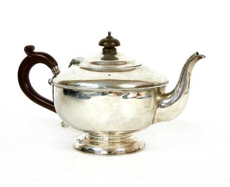 An early 20th century silver teapot, by Henry Clifford Davis, Birmingham (date rubbed), Ogdens Harrogate &amp; London retail 