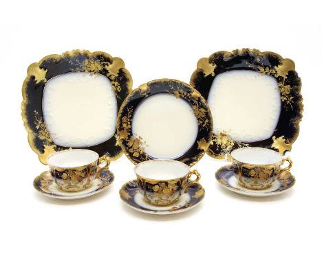 A 19th century limoges tea service , having foliate decorated reserves within blue royal border heightened in gilt