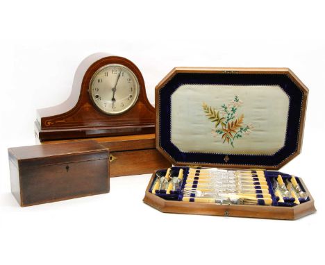 A mahogany cased canteen of cutlery, together with a mahogany mantel clock, a brass bound writing slope and a mahogany tea ca
