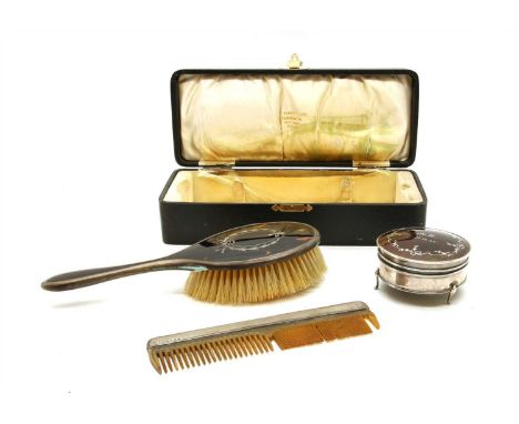 A silver and tortoiseshell circular trinket box, together with a similar hairbrush and a silver mounted engine turned comb