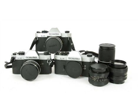 A group of three Rolleiflex SL35 camera bodies, together with five lenses to include four varying Rolle 50mm f/18 Planar and 