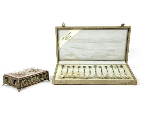 Twelve Dutch silver spoons, each with a different cast flowerhead to the finial, complete in box, together with a Dutch silve