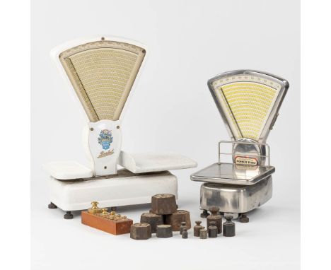 Berkel, two scales, enamelled and inox.Added are a collection of weights.Dimensions: (L:28 x W:55 x H:68 cm)