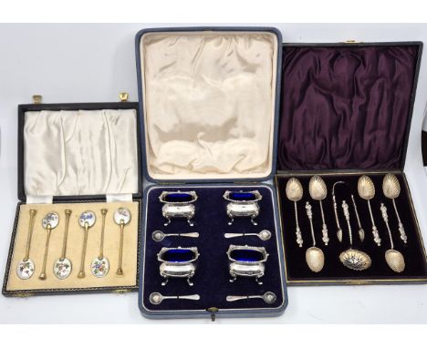 A set of six silver gilt enamel coffee spoons, by William Suckling Ltd, Birmingham 1957, having different enamel flowers to e