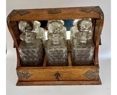 A 19th cent tantalus and a collection of boxes to include a fine quality Sarcophagus tea caddy