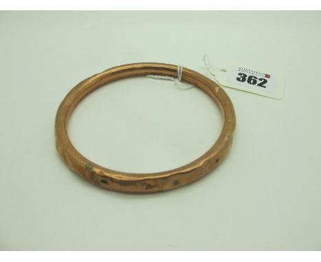 A 9ct Rose Gold Bangle, (dents / damage) (13grams). 