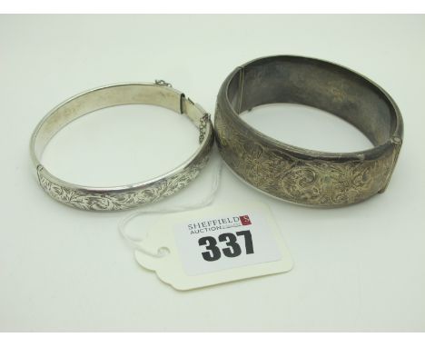 A Charles Horner Chester Hallmarked Silver Hinged Bangle, together with a wide hallmarked silver hinged bangle, (dents). (2) 