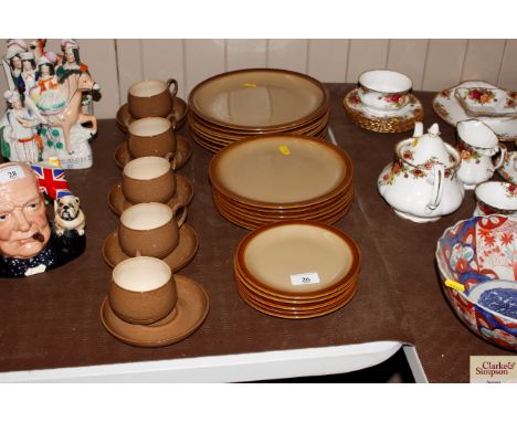 A quantity of Pearsons of Chesterfield pottery dinner plates; and six similar tea cups and saucers 