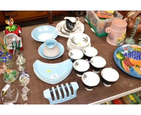 A small collection of Poole pottery twin tone dinnerware; and a quantity of Royal Albert "Night &amp; Day" teaware 