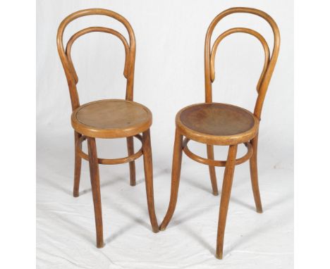A pair of bentwood high seat chairs and a low stool made from a section of walnut? trunk, 16" dia