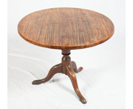 A George III oak circular occasional table, on tripod base (cut down)