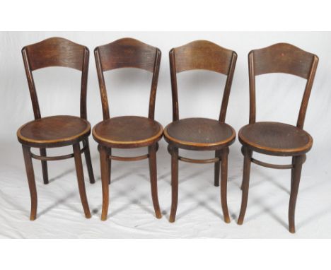 A set of four Thonet dark stained bentwood café chairs with drop-in panel seats