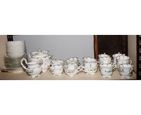 A 19th Century porcelain tea and coffee service decorated in green and gilt, fifty pieces approx
