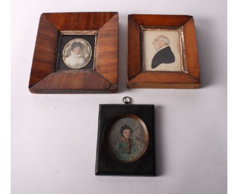 A 19th Century portrait miniature on ivory of an unknown woman, in glass mount and mahogany frame, a similar portrait miniatu