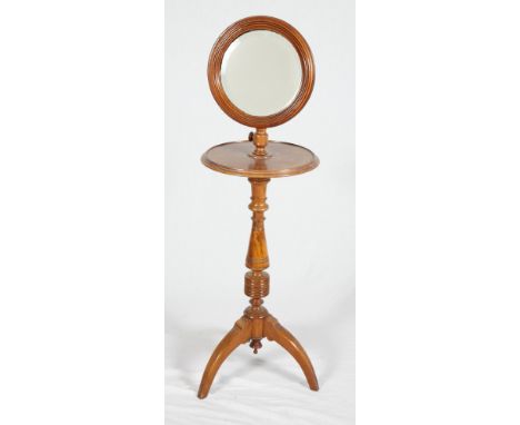 A 19th Century mahogany shaving stand with circular tray, on tripod splay supports