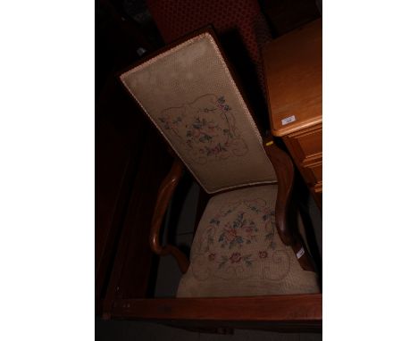 An open armchair, upholstered in a floral tapestry