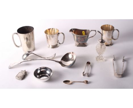 A plated soup ladle, two pairs of plated sugar tongs and other items of plate
