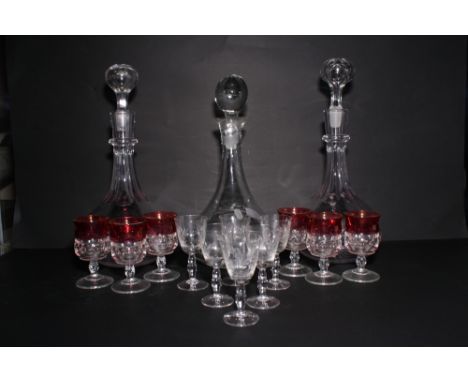 A pair of decanters cut ovals, a plain glass decanter and twelve assorted drinking glasses