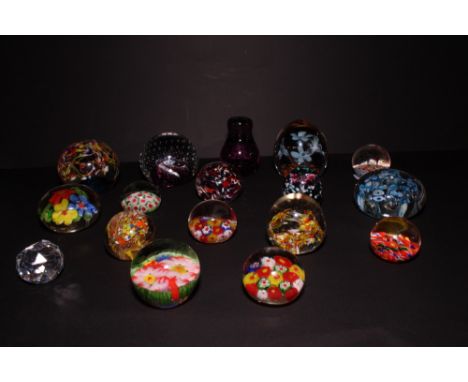 A Caithness glass paperweight with controlled bubble design and sixteen modern glass paperweights, various