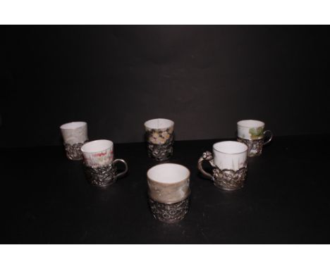 A matched set of six Japanese tea glass holders with pierced and embossed decoration