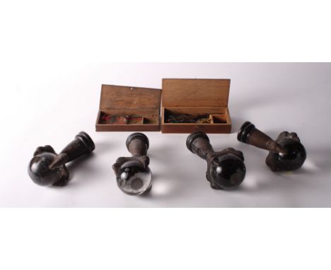 A set of four 19th Century furniture feet with a cast iron claw holding a glass ball and two sets of balance scales in wooden