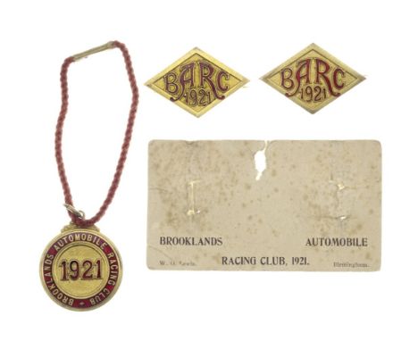 A set of three BARC Brooklands member's and guest's lapel badges, 1921,number 624, red enamel, member's badge with cord, and 