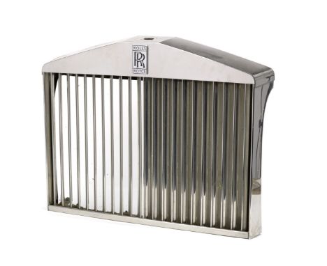A Rolls-Royce radiator grille, post-War,polished stainless steel surround and grille, with shutters and fitted with black ena
