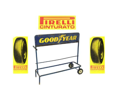 A 'Goodyear' wheeled tyre rack,blue-painted square-section steel frame, with plastic grip handles and two wheels with solid r