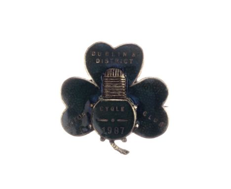 A Dublin &amp; District Motor Cycle Club lapel badge, 1907,green enamel, in the form of a shamrock with single cylinder engin