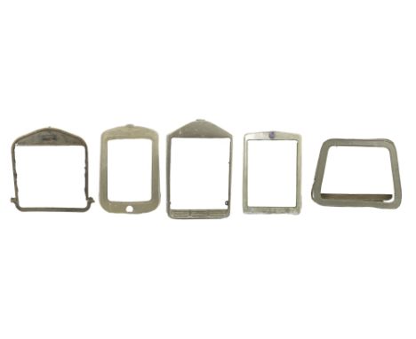 Five pre-War radiator surrounds,for Morris Minor, with enamel badge (chipped), Ford, Austin, and two unidentified, one in two